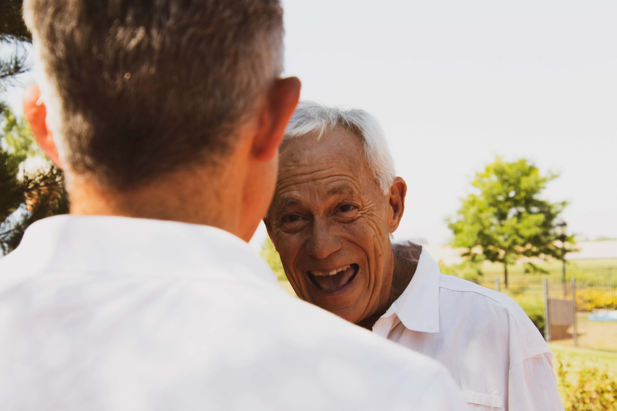 Elderly man happy to see his friend.
